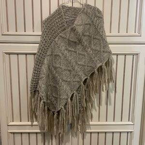 Beautiful beige cream poncho. Brand new with tags. Two different patterns knit